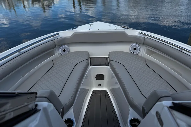 Luna Sea Yacht Photos Pics 2023 Pursuit DC 266 Dual Console boat interior with cushioned seating and speakers.