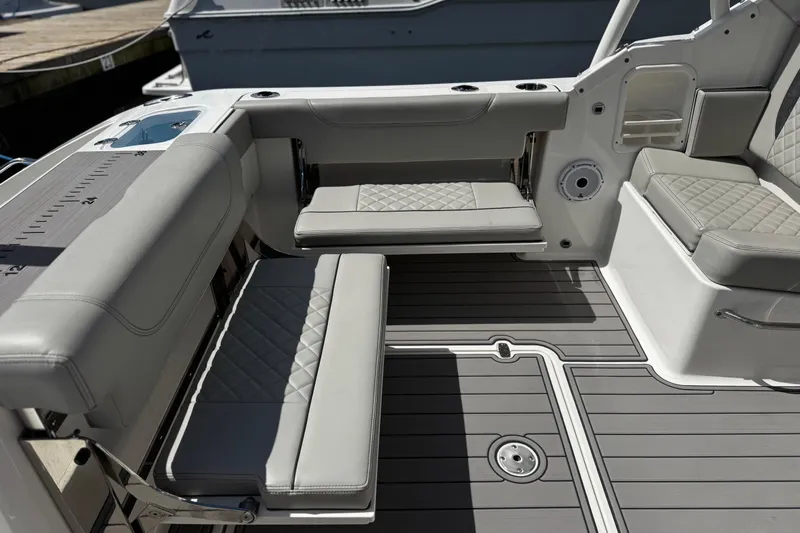 Luna Sea Yacht Photos Pics 2023 Pursuit DC 266 Dual Console boat interior with cushioned seating and sleek design.