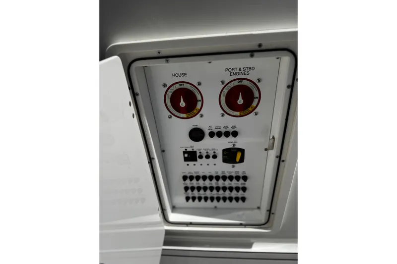 Luna Sea Yacht Photos Pics Control panel of 2023 Pursuit DC 266 Dual Console boat, featuring switches and dials.