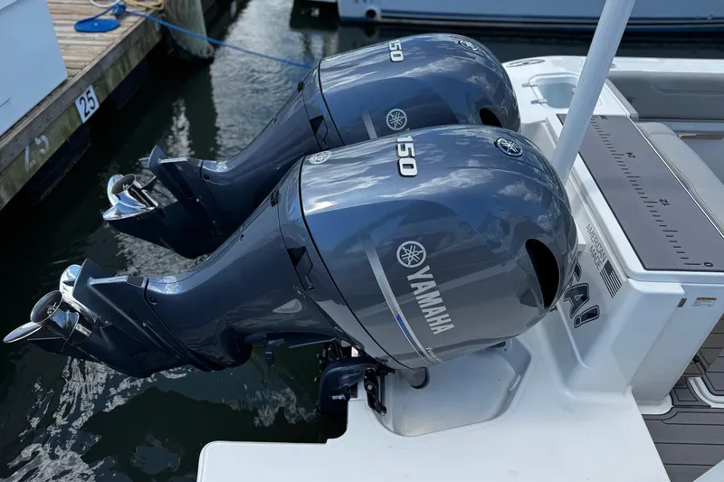 Luna Sea Yacht Photos Pics 2023 Pursuit DC 266 Dual Console with twin Yamaha 150 outboard engines at dock.