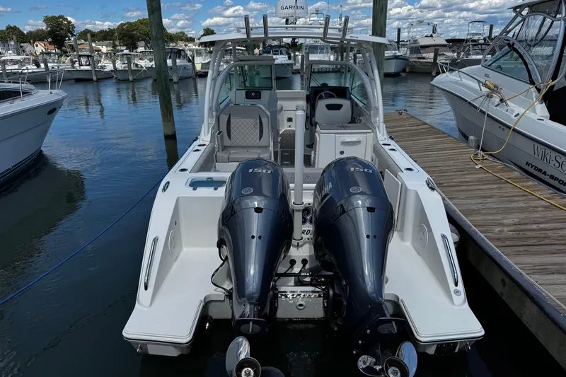 Luna Sea Yacht Photos Pics 2023 Pursuit DC 266 Dual Console boat docked with twin Yamaha engines.