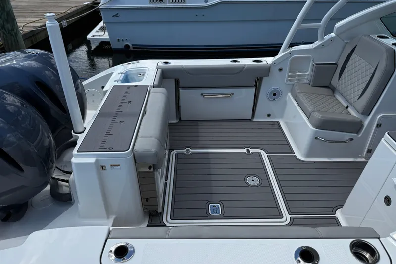 Luna Sea Yacht Photos Pics 2023 Pursuit DC 266 Dual Console boat interior with seating and deck details.