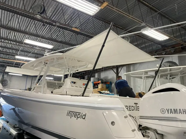 Herediterry Yacht Photos Pics 2017 Intrepid 375 FE boat in a workshop with Yamaha engines.