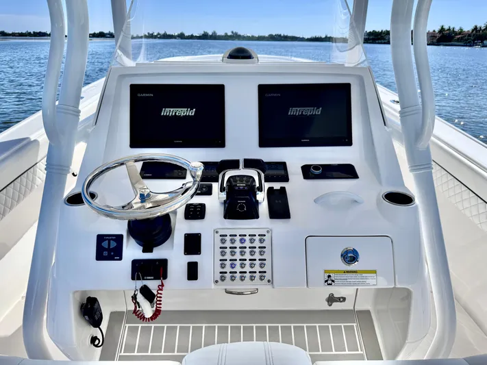 Herediterry Yacht Photos Pics 2017 Intrepid 375 FE boat dashboard with dual Garmin displays and steering wheel.