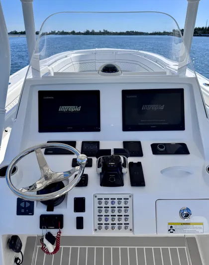 Herediterry Yacht Photos Pics 2017 Intrepid 375 FE boat dashboard with dual Garmin displays and steering wheel.