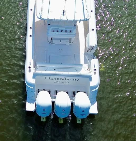 Herediterry Yacht Photos Pics Aerial view of 2017 Intrepid 375 FE boat with triple engines on water.