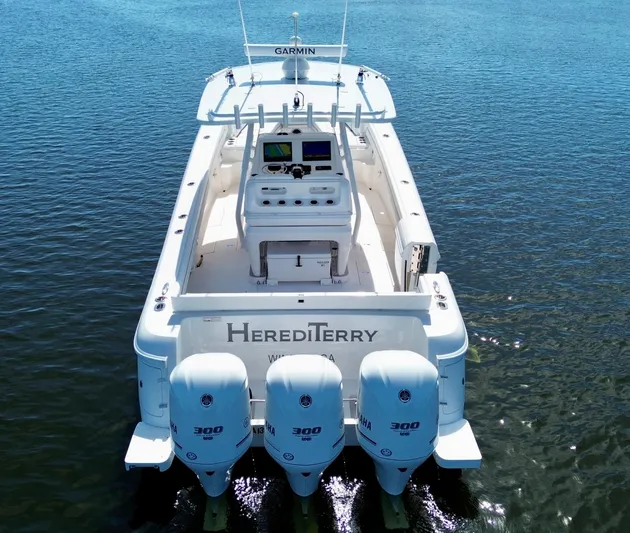 Herediterry Yacht Photos Pics 2017 Intrepid 375 FE boat with triple Yamaha engines on calm water.