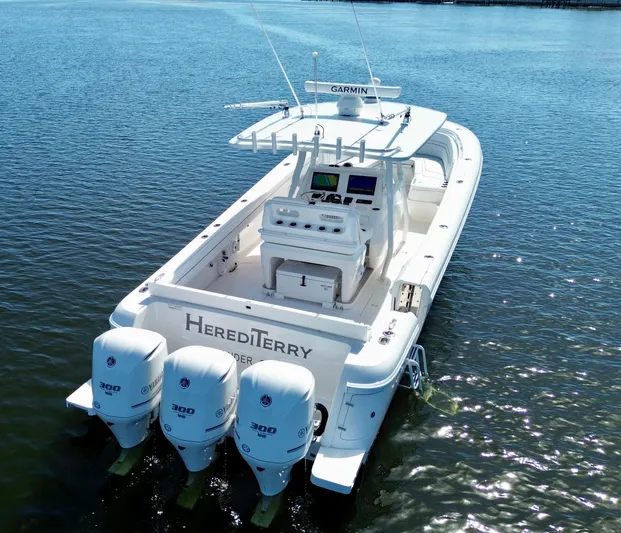 Herediterry Yacht Photos Pics 2017 Intrepid 375 FE boat with triple Yamaha engines on calm water.