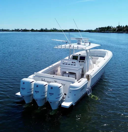 Herediterry Yacht Photos Pics 2017 Intrepid 375 FE boat with triple Yamaha engines on calm water.