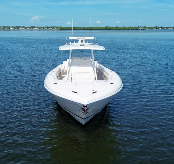Herediterry Yacht Photos Pics 2017 Intrepid 375 FE boat on calm water, clear sky background.