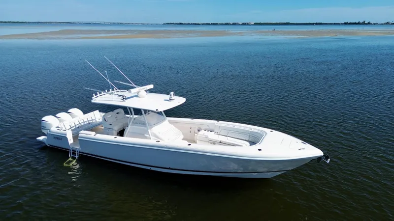 Herediterry Yacht Photos Pics 2017 Intrepid 375 FE boat on calm water, showcasing sleek design and triple engines.