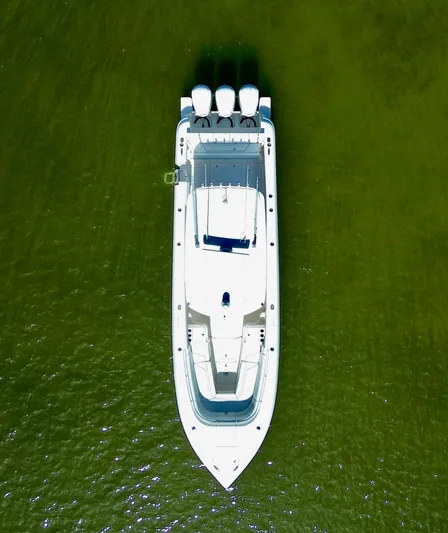 Herediterry Yacht Photos Pics Aerial view of 2017 Intrepid 375 FE boat on green water.