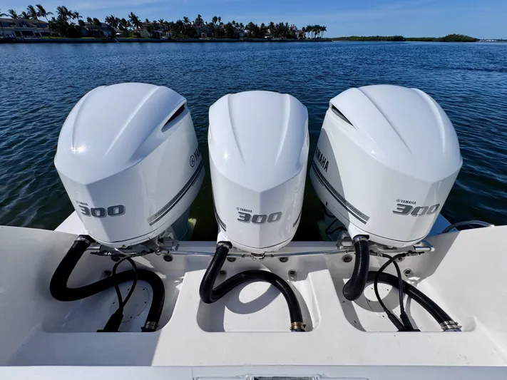 Herediterry Yacht Photos Pics Triple Yamaha 300 engines on a 2017 Intrepid 375 FE boat, docked on a sunny day.