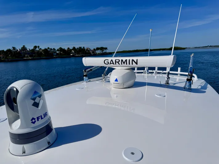 Herediterry Yacht Photos Pics 2017 Intrepid 375 FE boat with Garmin and FLIR equipment on deck, near calm waters.