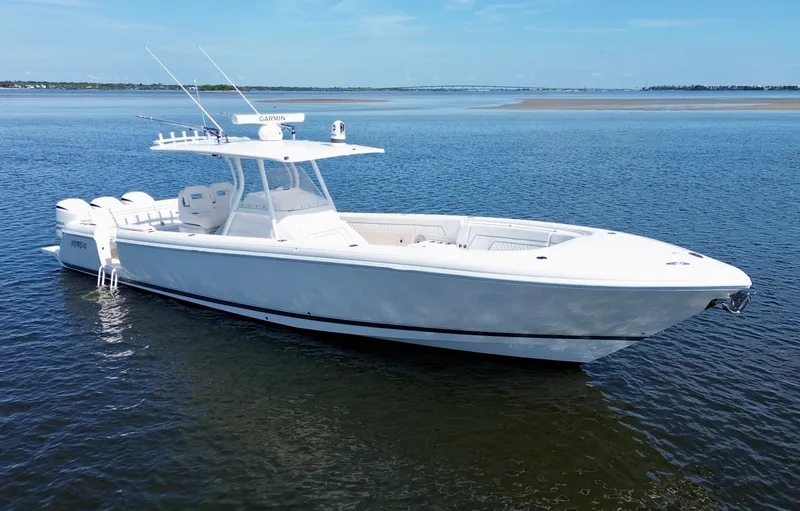 Herediterry Yacht Photos Pics 2017 Intrepid 375 FE boat on calm water, clear sky background.