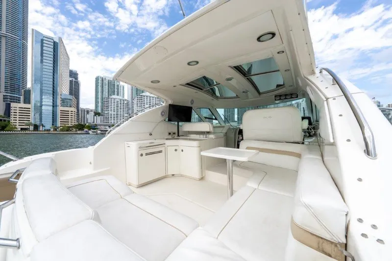  Yacht Photos Pics Luxurious 2009 Sea Ray 43 Sundancer yacht interior with city skyline backdrop.