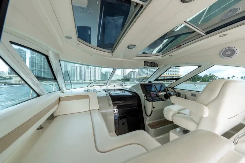  Yacht Photos Pics Luxurious interior of 2009 Sea Ray 43 Sundancer yacht with city skyline view.