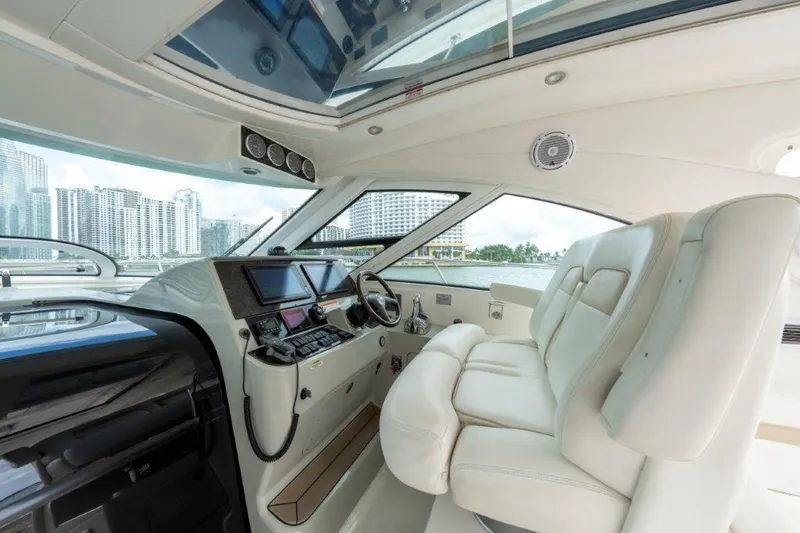  Yacht Photos Pics Interior of 2009 Sea Ray 43 Sundancer yacht with modern helm and plush seating.