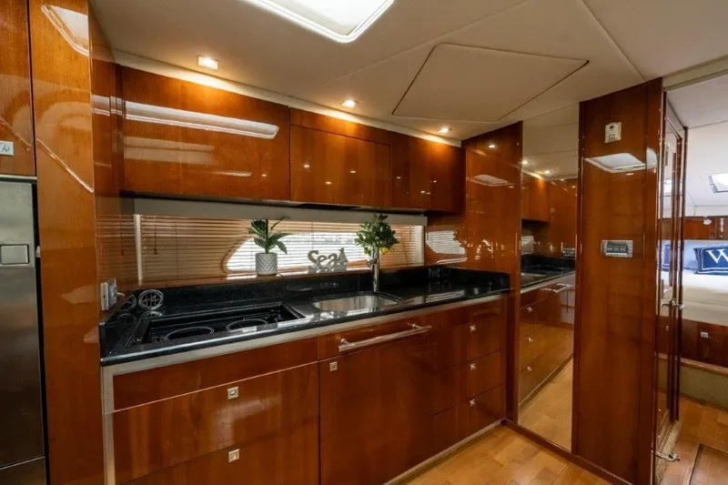  Yacht Photos Pics Luxurious 2009 Sea Ray 43 Sundancer yacht interior with sleek wooden cabinetry and modern kitchen amenities.