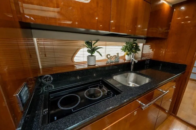  Yacht Photos Pics Luxurious kitchen in 2009 Sea Ray 43 Sundancer yacht with sleek countertops and modern appliances.