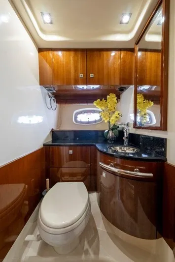  Yacht Photos Pics Luxurious bathroom in 2009 Sea Ray 43 Sundancer yacht with wood accents and modern fixtures.