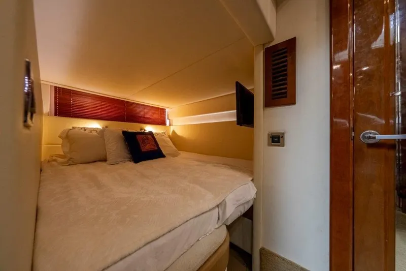  Yacht Photos Pics Luxurious cabin interior of 2009 Sea Ray 43 Sundancer yacht with cozy bedding.