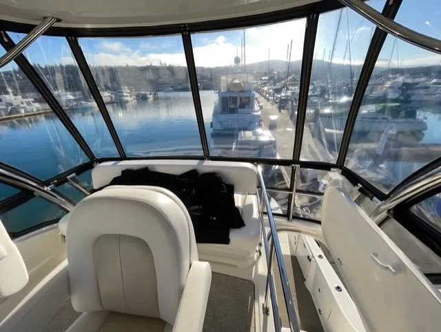 O Sea D Yacht Photos Pics 2010 Sea Ray 520 Sedan Bridge interior with marina view through large windows.