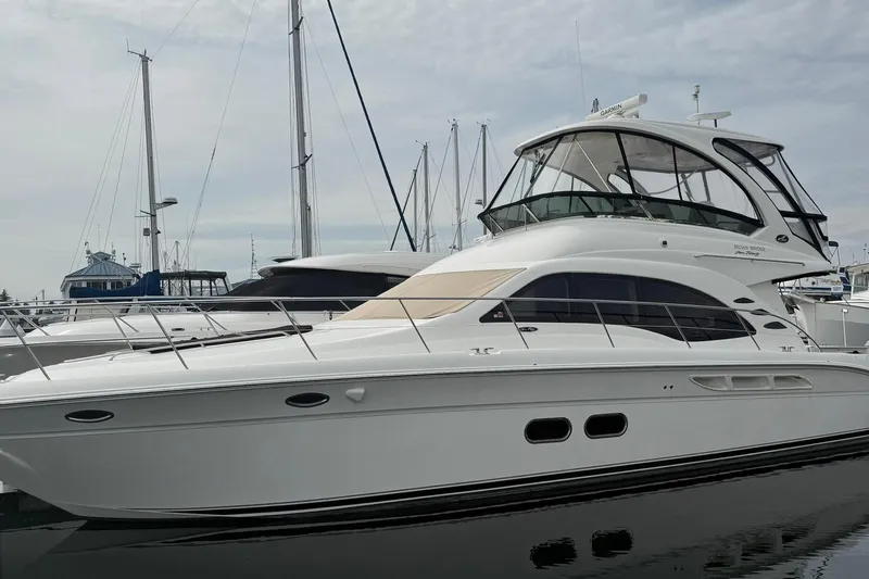 O Sea D Yacht Photos Pics 2010 Sea Ray 520 Sedan Bridge yacht docked at marina, showcasing sleek design and luxury features.