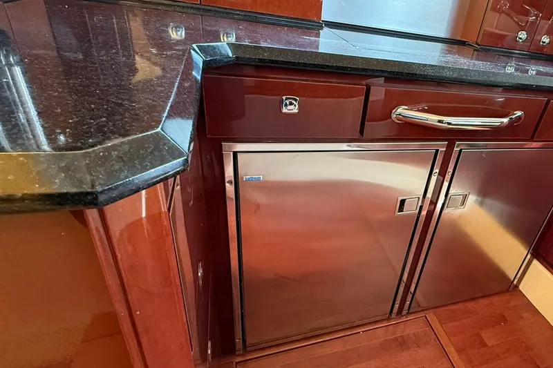 O Sea D Yacht Photos Pics Luxurious kitchen area in 2010 Sea Ray 520 Sedan Bridge yacht with sleek cabinetry.