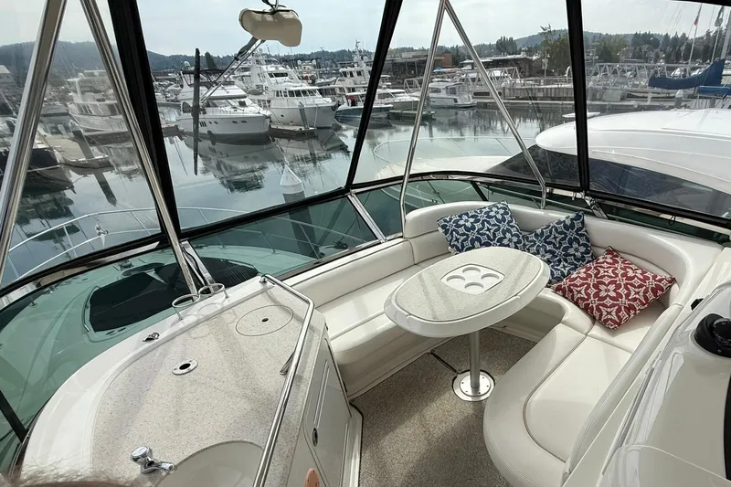 O Sea D Yacht Photos Pics Luxurious 2010 Sea Ray 520 Sedan Bridge interior with marina view, featuring plush seating and cushions.