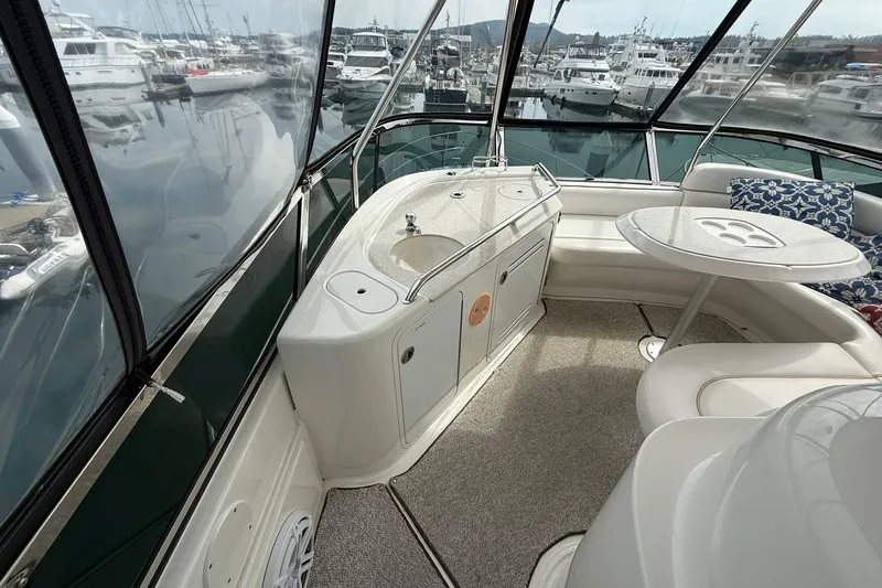 O Sea D Yacht Photos Pics 2010 Sea Ray 520 Sedan Bridge interior with seating, table, and marina view.