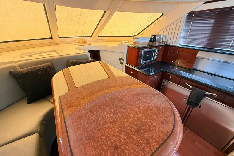 O Sea D Yacht Photos Pics Luxurious interior of 2010 Sea Ray 520 Sedan Bridge yacht with elegant wood finishes.