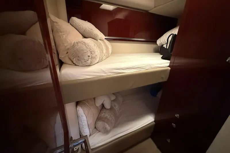 O Sea D Yacht Photos Pics Bunk beds in 2010 Sea Ray 520 Sedan Bridge yacht cabin with plush pillows.