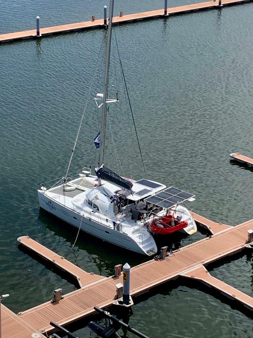 2019 Lagoon 380 S2 4/2 catamaran docked at marina with solar panels.