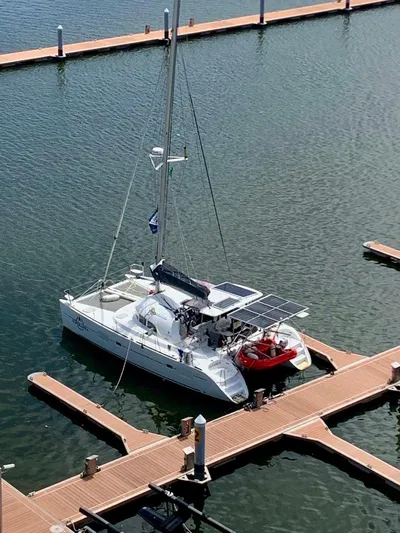 Esperanza Yacht Photos Pics 2019 Lagoon 380 S2 4/2 catamaran docked at marina with solar panels.