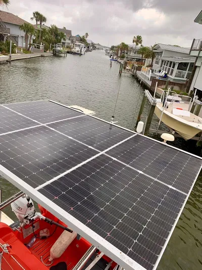 Esperanza Yacht Photos Pics Solar panels on a 2019 Lagoon 380 S2 4/2 catamaran in a canal setting.