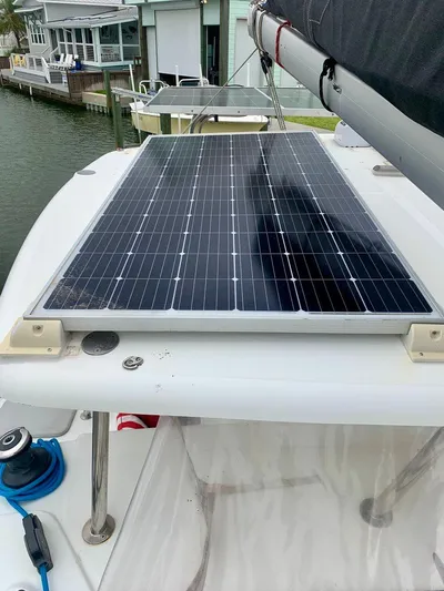 Esperanza Yacht Photos Pics Solar panel on 2019 Lagoon 380 S2 4/2 catamaran docked by waterfront homes.