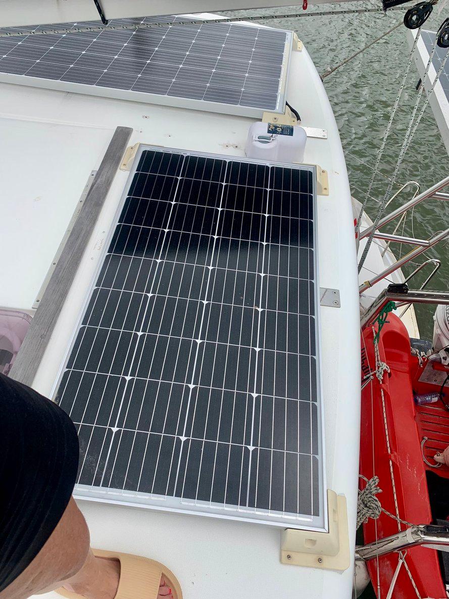 Solar panels on 2019 Lagoon 380 S2 4/2 catamaran deck, near water.