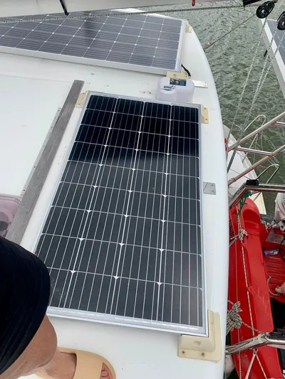 Esperanza Yacht Photos Pics Solar panels on 2019 Lagoon 380 S2 4/2 catamaran deck, near water.