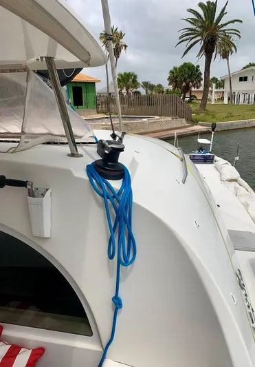 Esperanza Yacht Photos Pics Lagoon 380 S2 4/2 catamaran, 2019 model, docked with blue rope on deck.