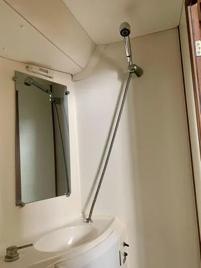Esperanza Yacht Photos Pics Bathroom interior of 2019 Lagoon 380 S2 4/2 yacht with shower and mirror.