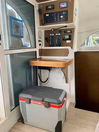 Esperanza Yacht Photos Pics Lagoon 380 S2 4/2 2019 yacht interior with control panel and Engel cooler.