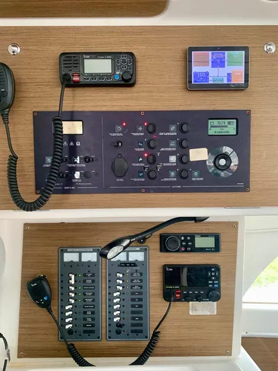 Esperanza Yacht Photos Pics Control panel of a 2019 Lagoon 380 S2 4/2 catamaran with navigation and communication equipment.