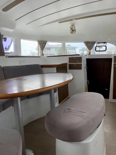 Esperanza Yacht Photos Pics Interior of 2019 Lagoon 380 S2 4/2 catamaran with dining area and seating.