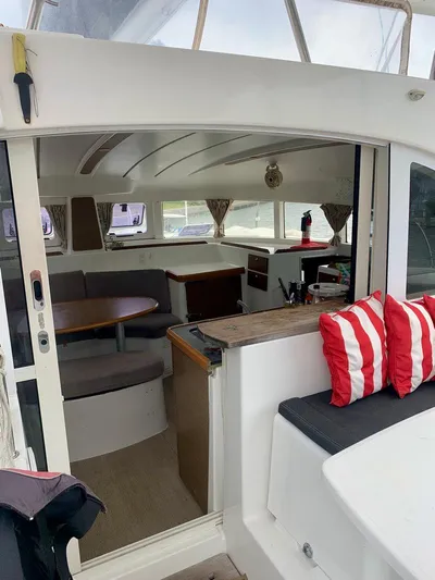 Esperanza Yacht Photos Pics Interior view of 2019 Lagoon 380 S2 4/2 catamaran with seating and striped cushions.