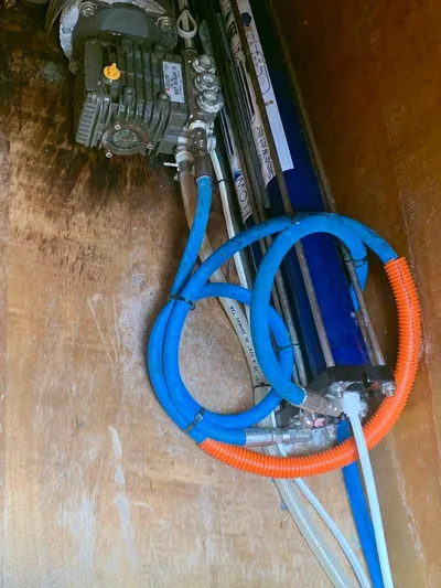 Esperanza Yacht Photos Pics Engine compartment of a 2019 Lagoon 380 S2 4/2 with visible hoses and machinery.