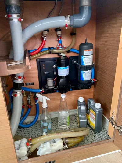 Esperanza Yacht Photos Pics Plumbing system inside Lagoon 380 S2 4/2 yacht, 2019 model, with maintenance supplies.