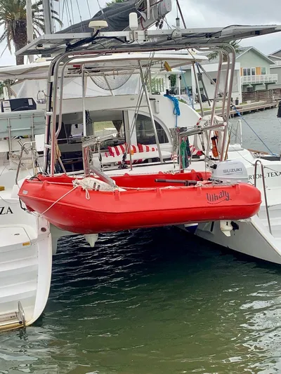 Esperanza Yacht Photos Pics Lagoon 380 S2 4/2 catamaran with red dinghy, docked in a marina, 2019 model.