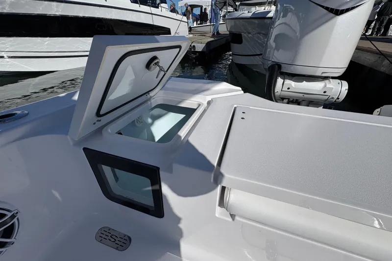  Yacht Photos Pics 2025 Sportsman Masters 267OE Bay Boat interior with open storage compartment.
