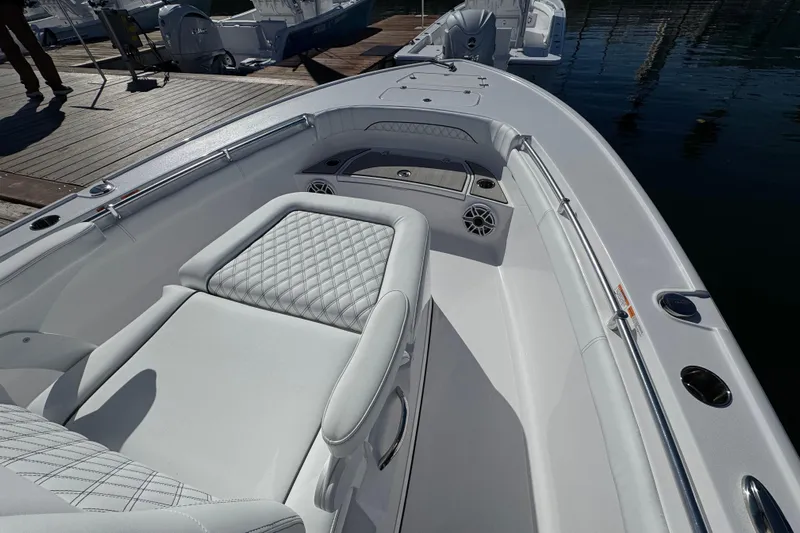  Yacht Photos Pics 2025 Sportsman Masters 267OE Bay Boat interior with cushioned seating and sleek design.